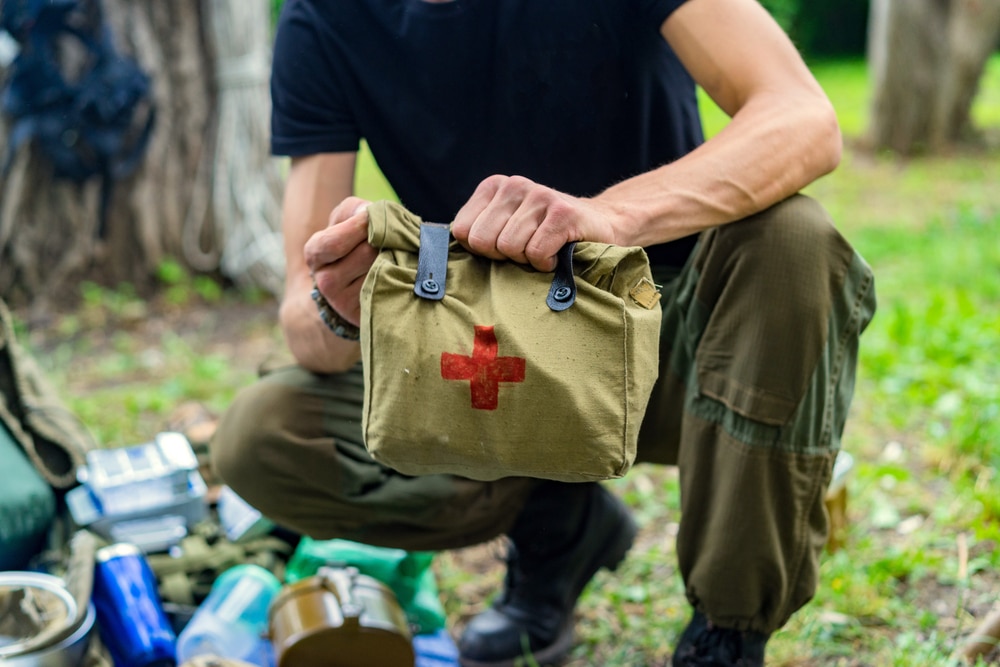 A person is prepared to perform basic first aid procedures